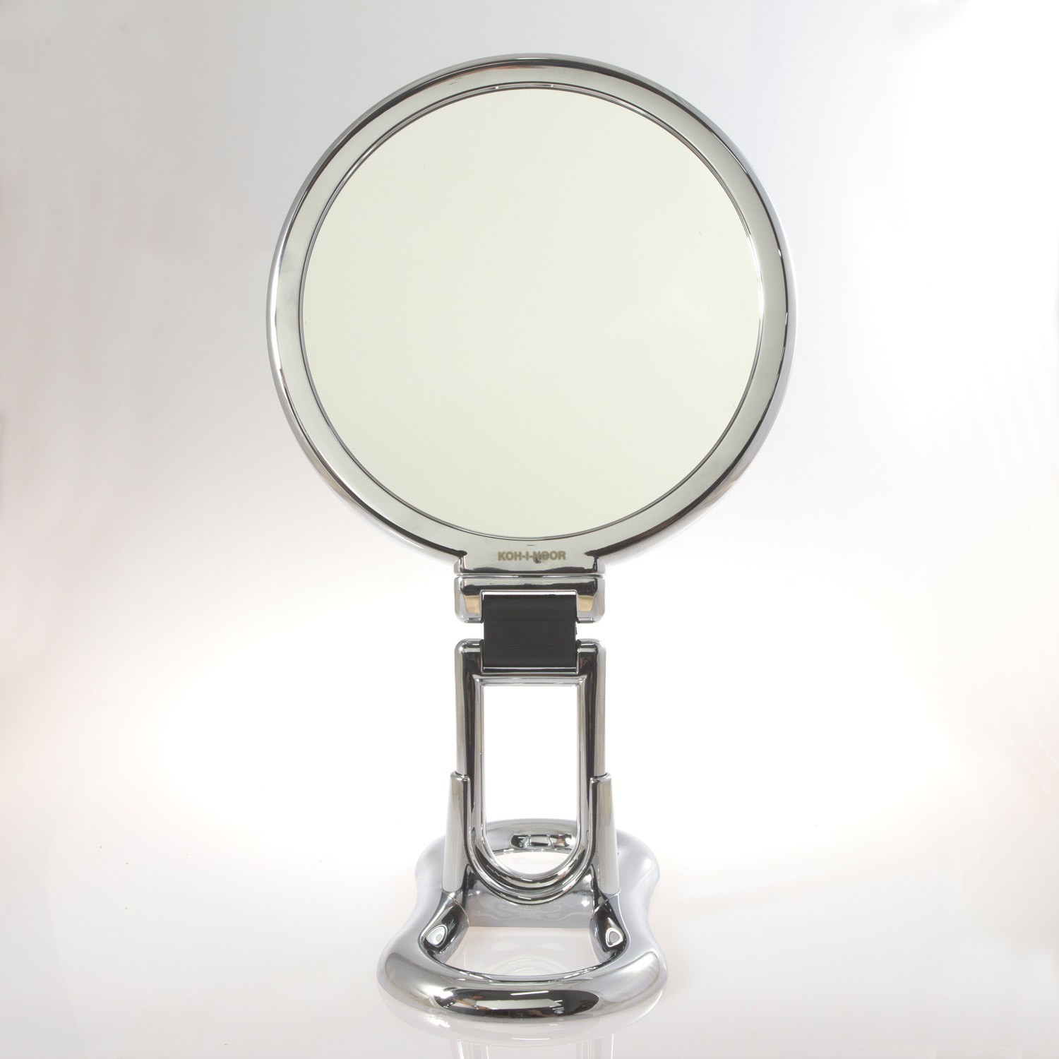 Specchio cromato bifacciale con ingrandimento x 3, manico pieghevole e  supporto da tavolo. Ø18cm.